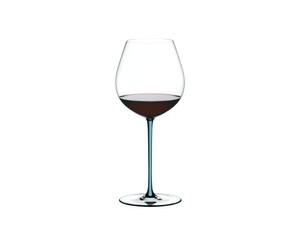A RIEDEL Fatto A Mano Pinot Noir glass in turquoise filled with red wine on a transparent background. 
