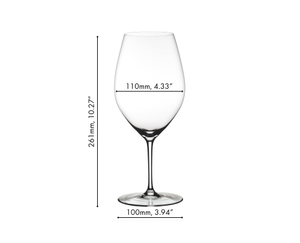 A RIEDEL Wine Friendly glass filled with white wine in front of a white background. 
