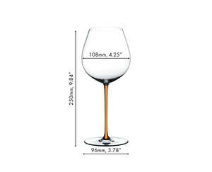 A RIEDEL Fatto A Mano Pinot Noir glass in orange filled with red wine on a white background. 