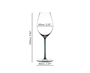 A RIEDEL Fatto A Mano Champagne Wine Glass in green stands together with a bottle of wine, a white, a dark blue, a yellow, a red and a black Fatto A Mano Champagne Wine Glass against a gray background. 