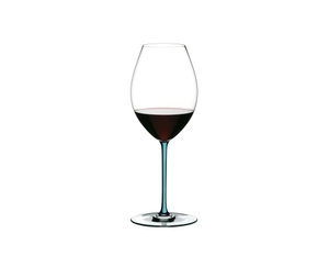 A RIEDEL Fatto A Mano Syrah glass in turquoise filled with red wine on a transparent background. 