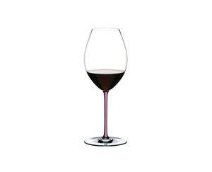 A RIEDEL Fatto A Mano Champagne Wine Glass in mauve filled with champagne on a transparent background. 