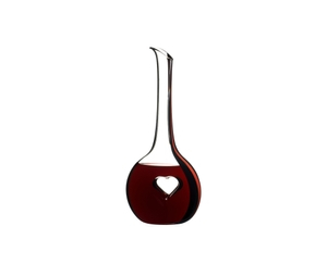 RIEDEL Black Tie Bliss Decanter - red filled with a drink on a white background