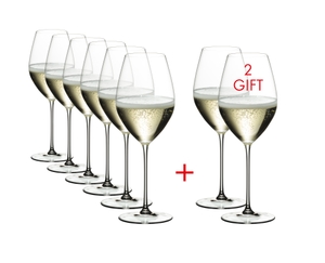 Six RIEDEL Veritas Champagne Wine Glasses plus two filled with champagne tand side by side or slightly behind each other on a transparent background. 