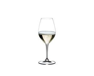 RIEDEL Vinum Champagne Wine Glass filled with a drink on a white background