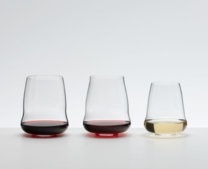 A SL RIEDEL Stemless Wings Pinot Noir/Nebbiolo glasses on a white background filled with red wine. 