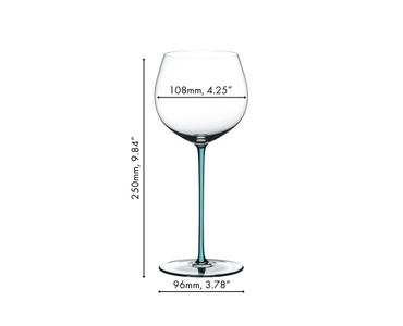 A RIEDEL Fatto A Mano Oaked Chardonnay glass in turquoise filled with white wine on a white background. 