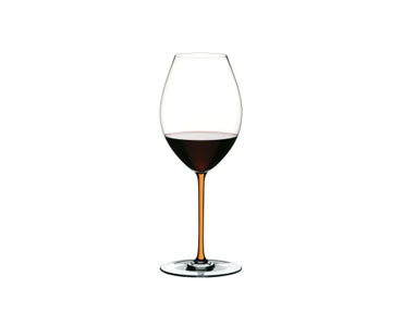 A RIEDEL Fatto A Mano Syrah glass in orange filled with red wine on a transparent background. 