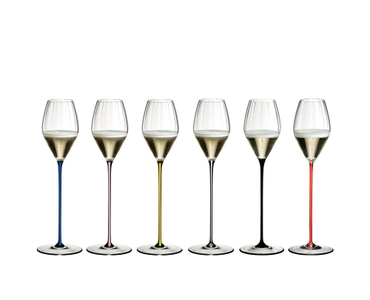 An unfilled RIEDEL High Performance Champagne Glass with a pink stem on a white background with product dimensions: Height: 325 mm | 12.8 inch Biggest diameter: 79 mm | 3.11 inch Base diameter: 100 mm | 3.78 inch. 