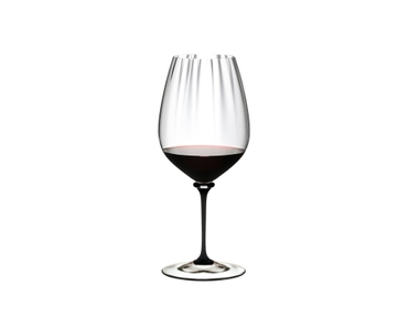 RIEDEL Fatto A Mano Performance Cabernet/Sauvignon - black stem filled with a drink on a white background