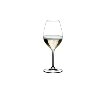 RIEDEL Vinum Champagne Wine Glass filled with a drink on a white background