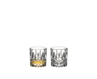 RIEDEL Tumbler Collection RIEDEL Spey Single Old Fashioned filled with a drink on a white background
