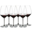 RIEDEL Extreme Shiraz filled with a drink on a white background
