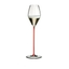 A RIEDEL High Performance Champagne Glass with a red stem filled with champagne on a transparent background. 