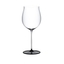 RIEDEL Fatto A Mano Black Tie Burgundy Grand Cru filled with a drink on a white background