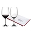 RIEDEL Vinum + Gift filled with a drink on a white background