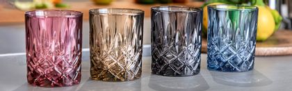 Nachtmann Noblesse Whisky Tumblers in berry, tobacco, smoke and vintage blue lined up