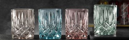 The NACHTMANN Noblesse whiskey tumblers in the fresh colors taupe, aqua, rosé and mint in a row.<br/>
