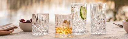 Nachtmann Noblesse glassware lined up in outdoor setting