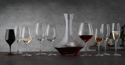 various wine glasses and a decanter on table