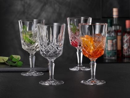 Four NACHTMANN Noblesse cocktail/wine glasses filled with summery cocktails