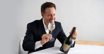 Maximilian Riedelwith a Riedel Champagne wine glass and a Dom Perignon bottle