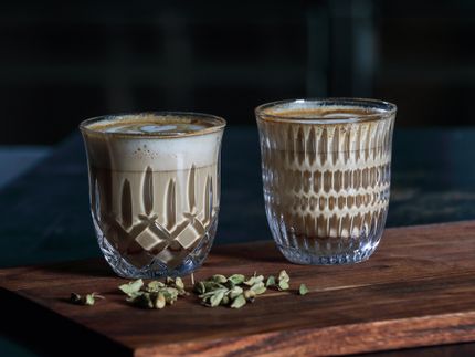 The NACHTMANN Barista Noblesse and Ethno Cappuccino/Flat White glass filled with coffee.