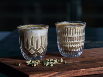 The NACHTMANN Barista Noblesse and Ethno Cappuccino/Flat White glass filled with coffee