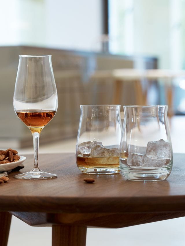 A table with SPIEGELAU whisky glasses on it.<br/>